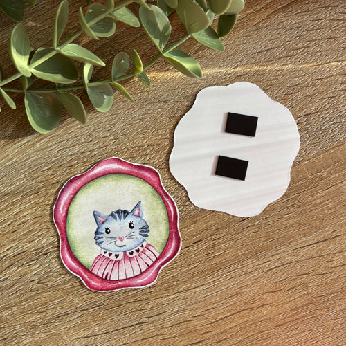 image représentant un aimant avec un portrait de chat