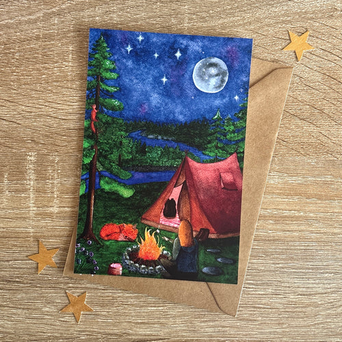 image montrant une carte imprimée de camping à la belle étoile avec enveloppe