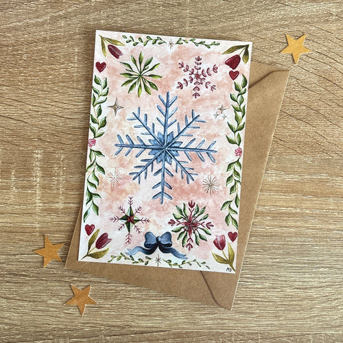 photo représentant une carte d'hiver et printemps avec des fleurs et des flocons