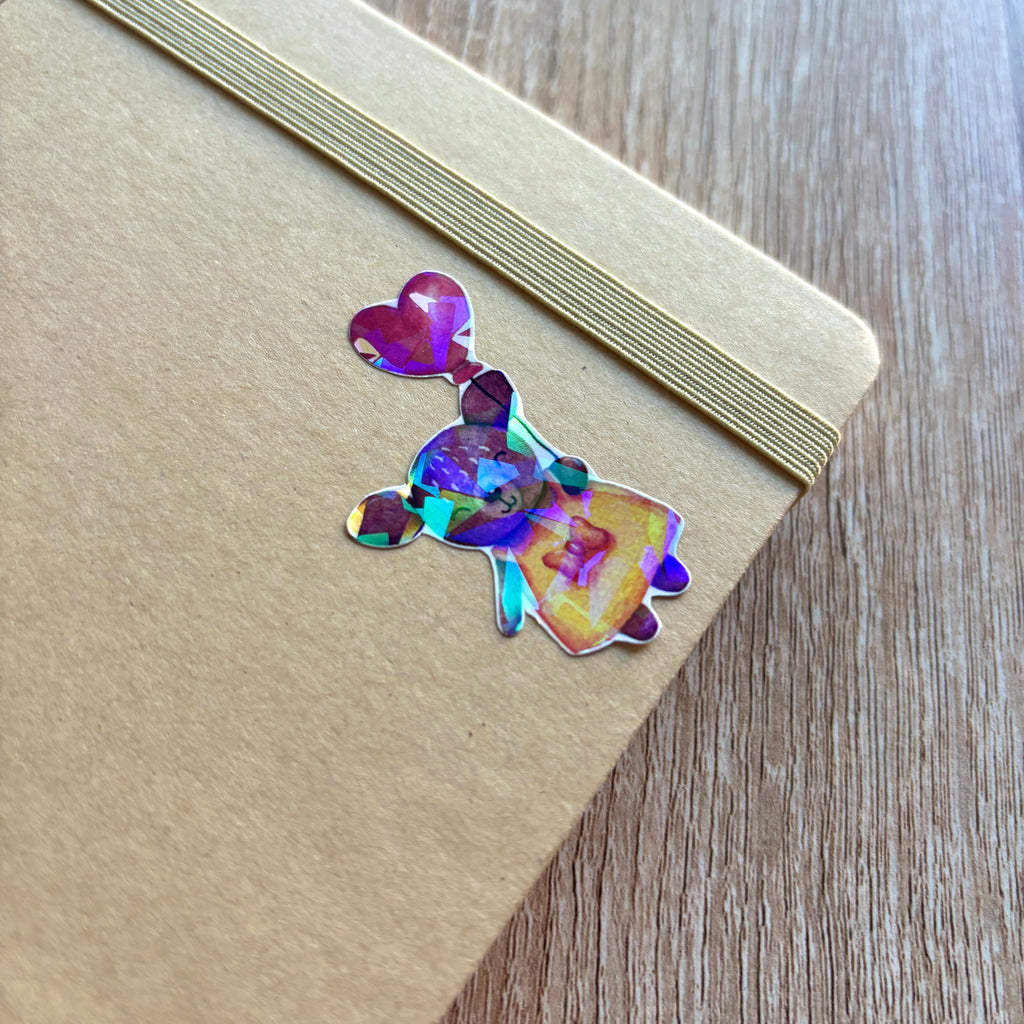 sticker représentant une biche avec un ballon en forme de cœur holographique